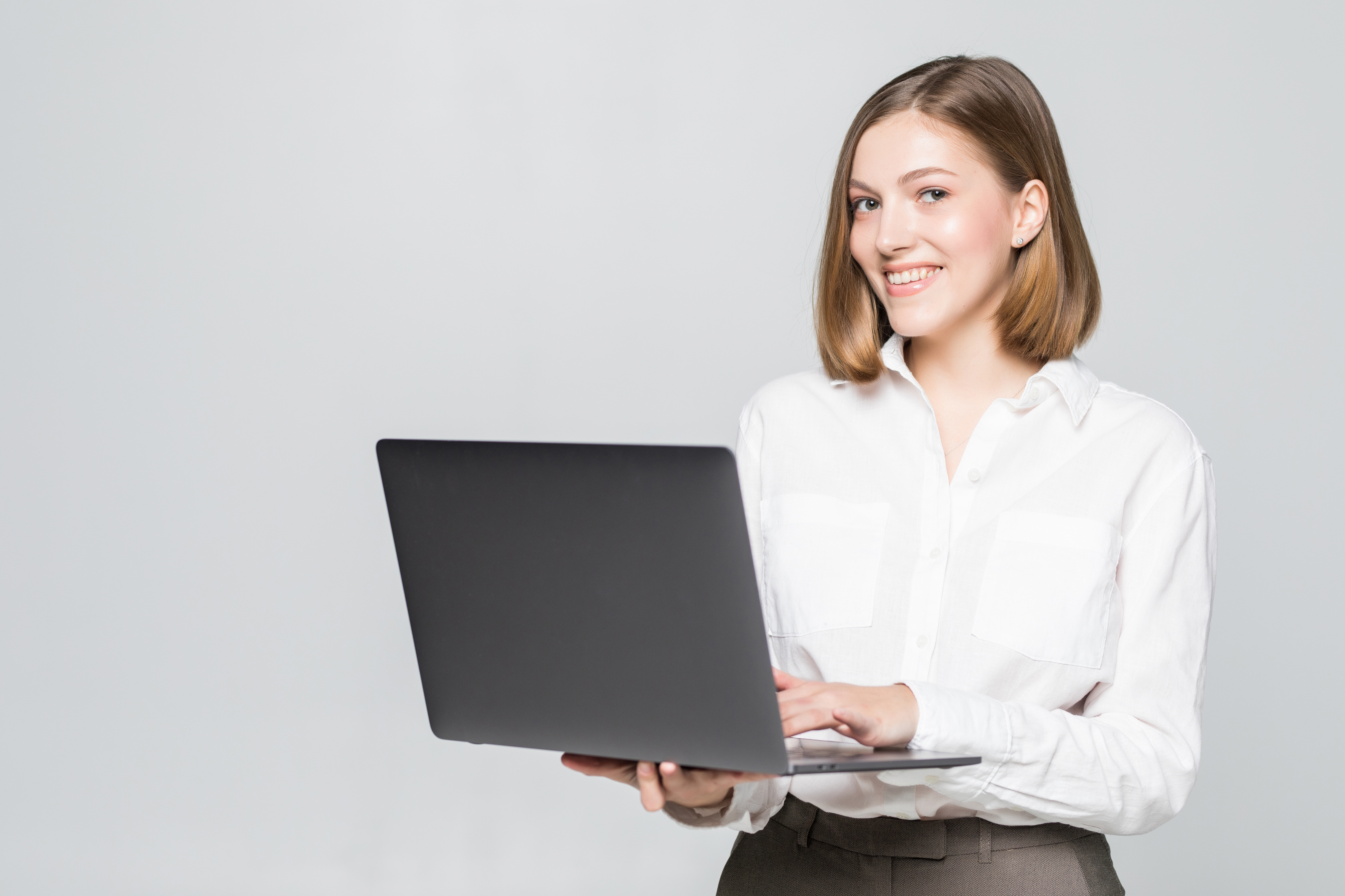 Professional woman working on laptop in office